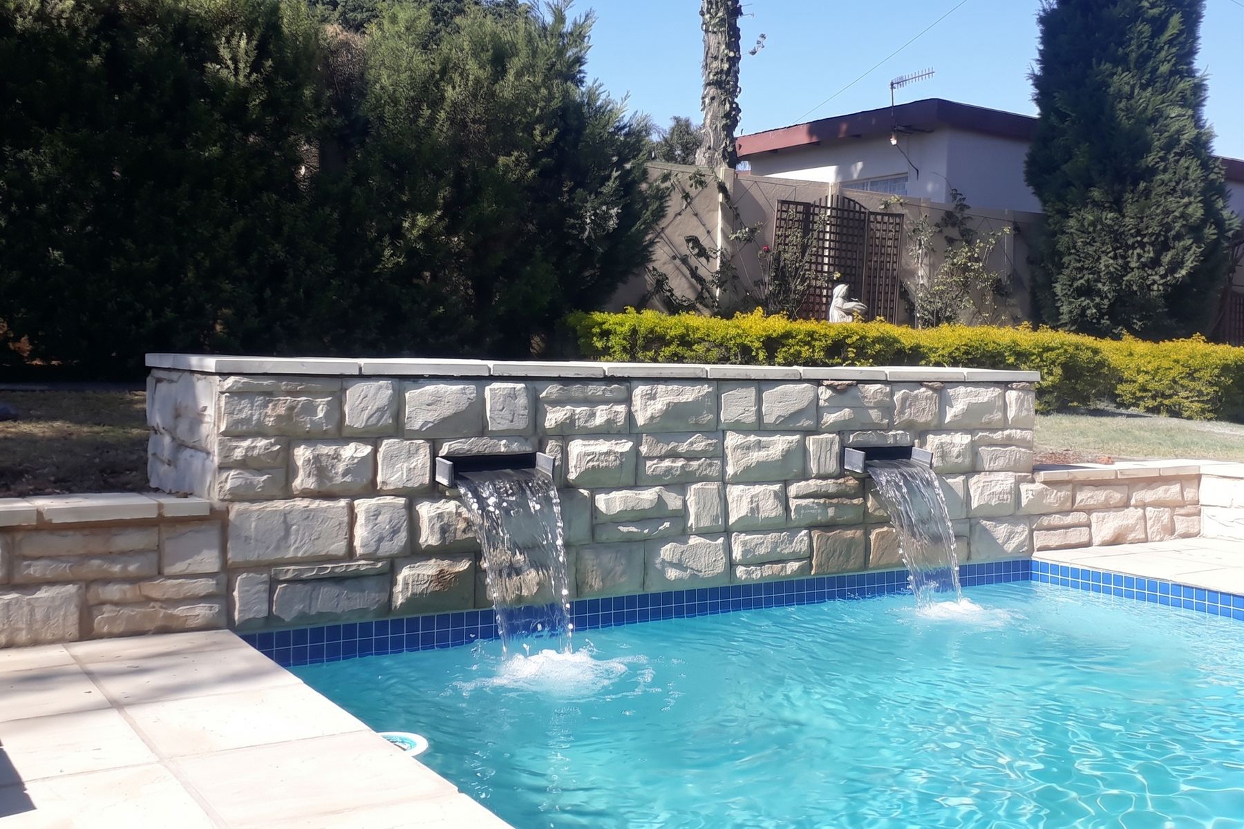 Pool with stone water feature