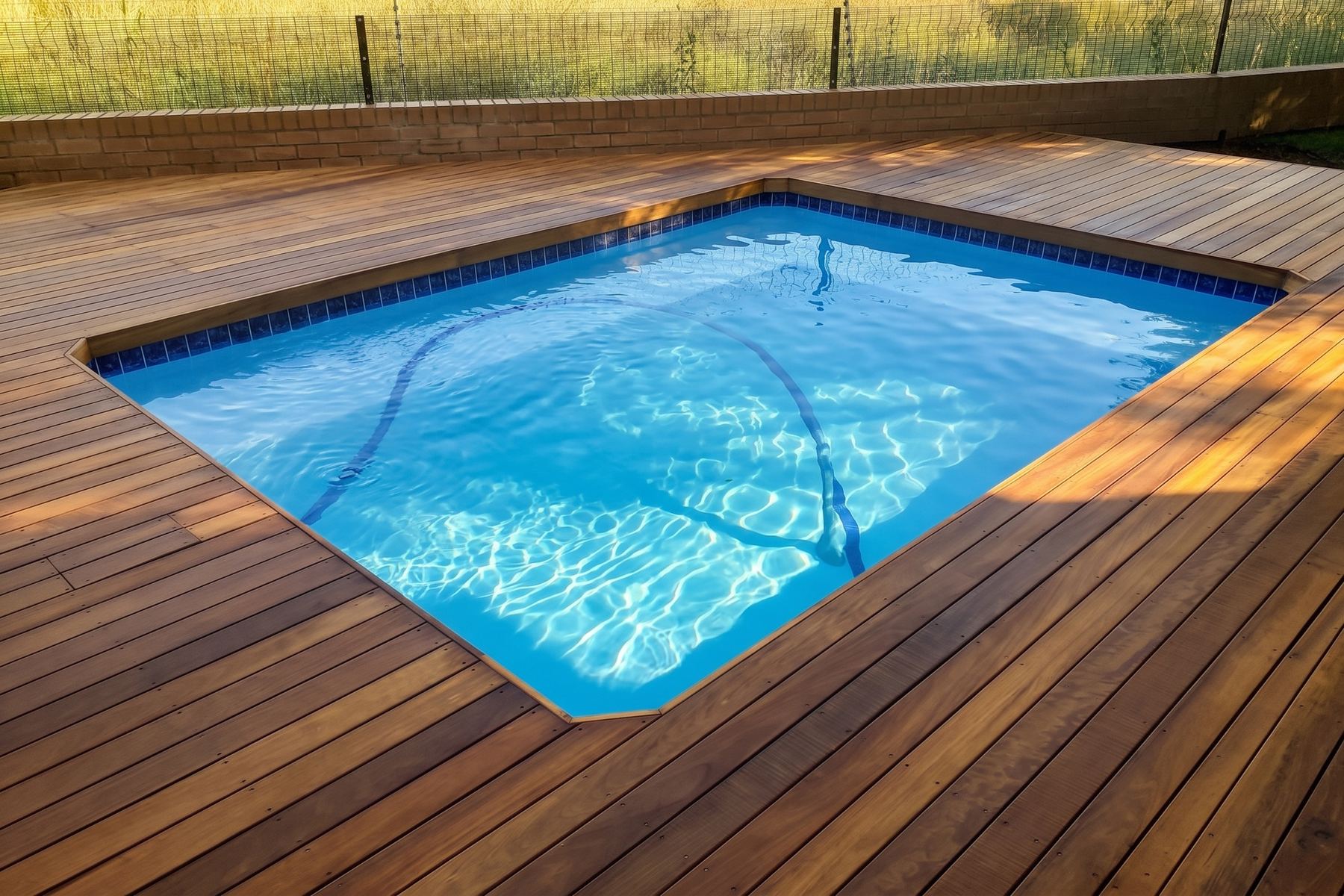 Square pool set into timber decking