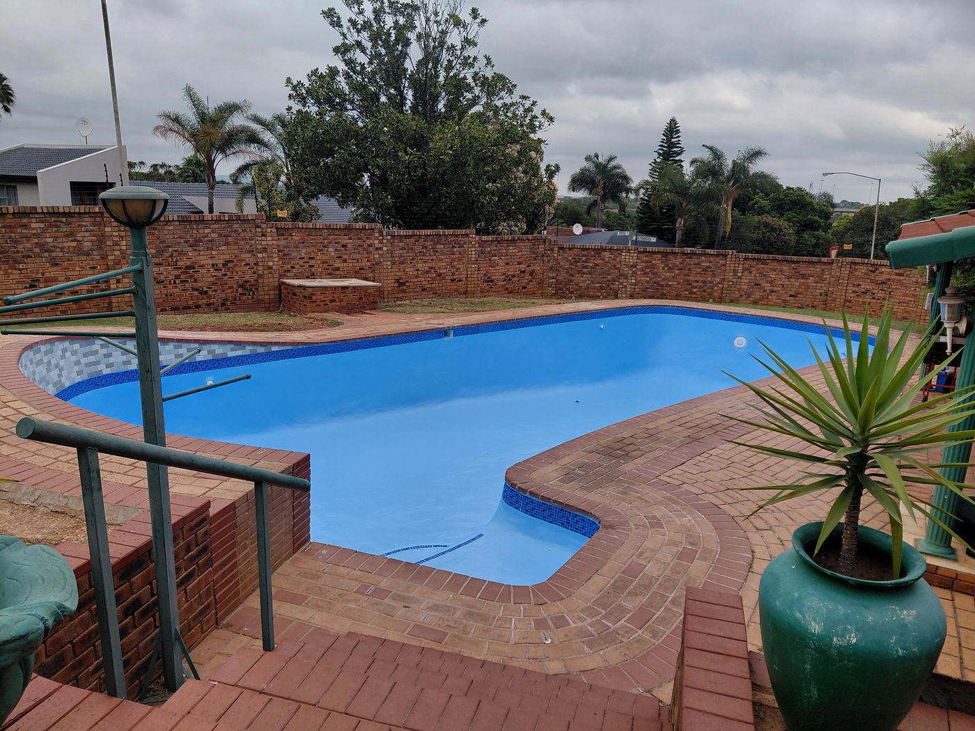 Renovated pool with a new finish and mosaic tile band